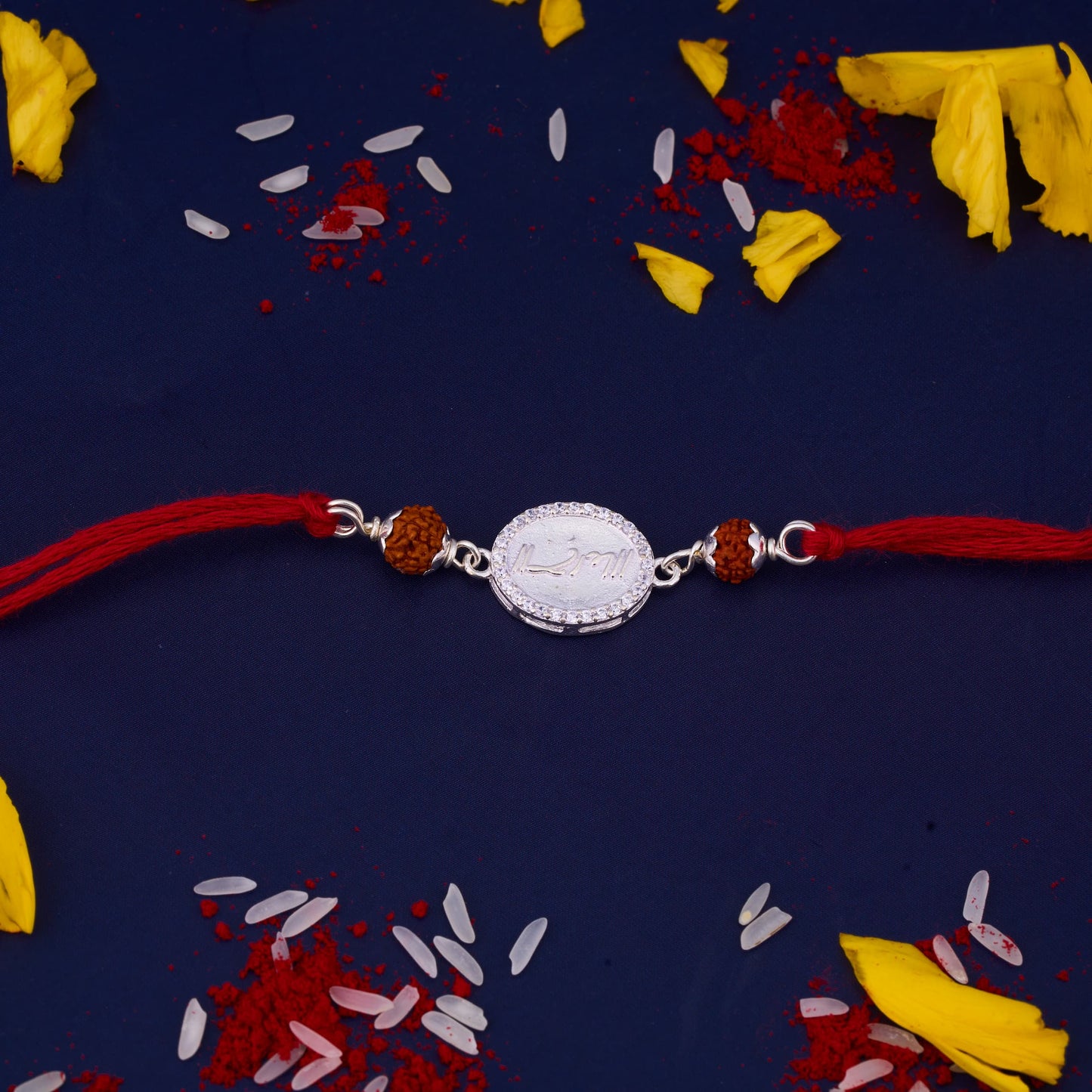 Silver Rudraksh Rakhi with written Ram with Diamond border