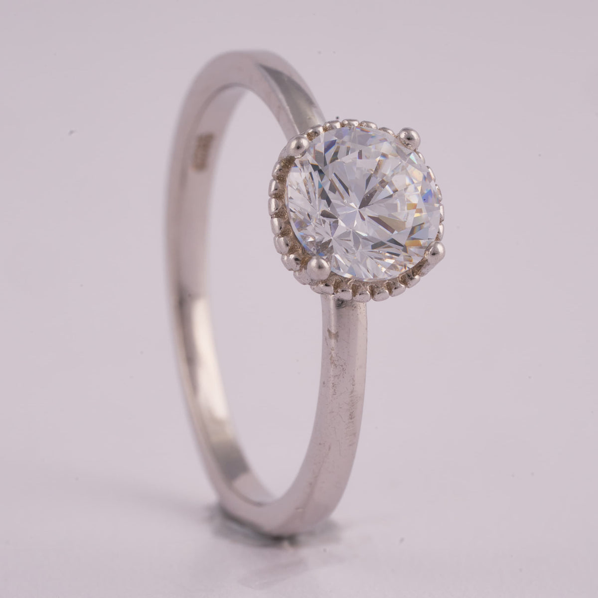 Silver Solitaire Ring with Beaded Halo Detail