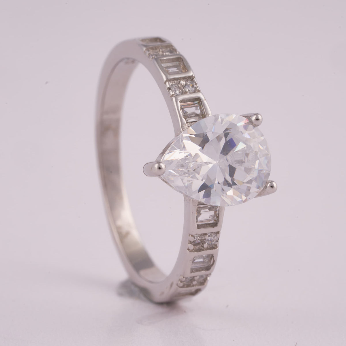 Silver Solitaire Ring with Baguette Accent Stones