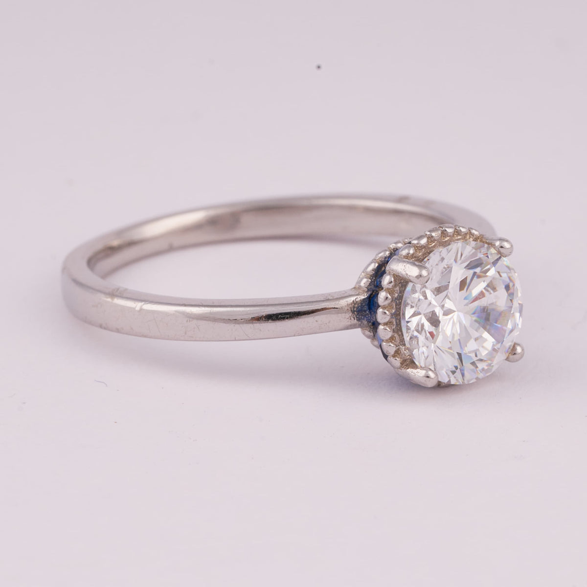 Silver Solitaire Ring with Beaded Halo Detail