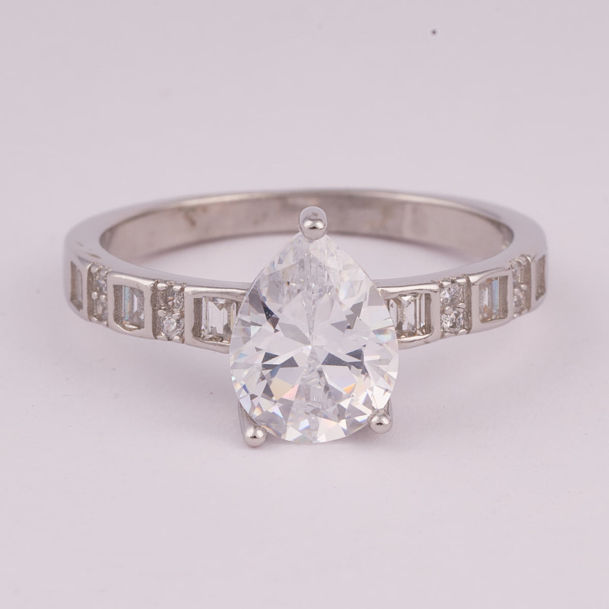 Silver Solitaire Ring with Baguette Accent Stones