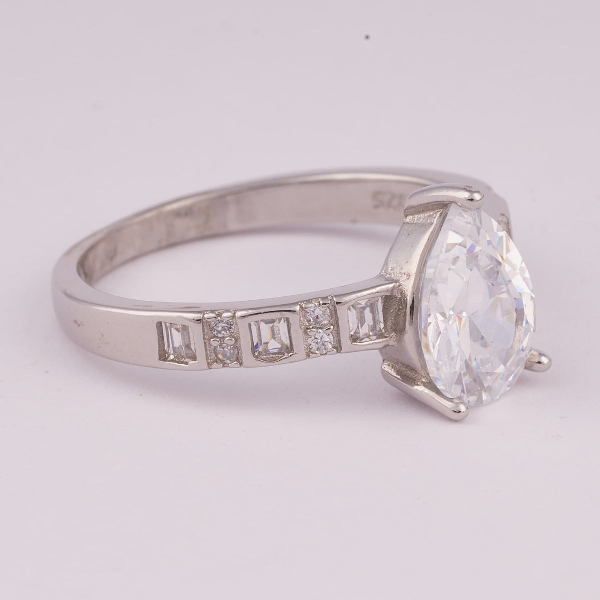 Silver Solitaire Ring with Baguette Accent Stones