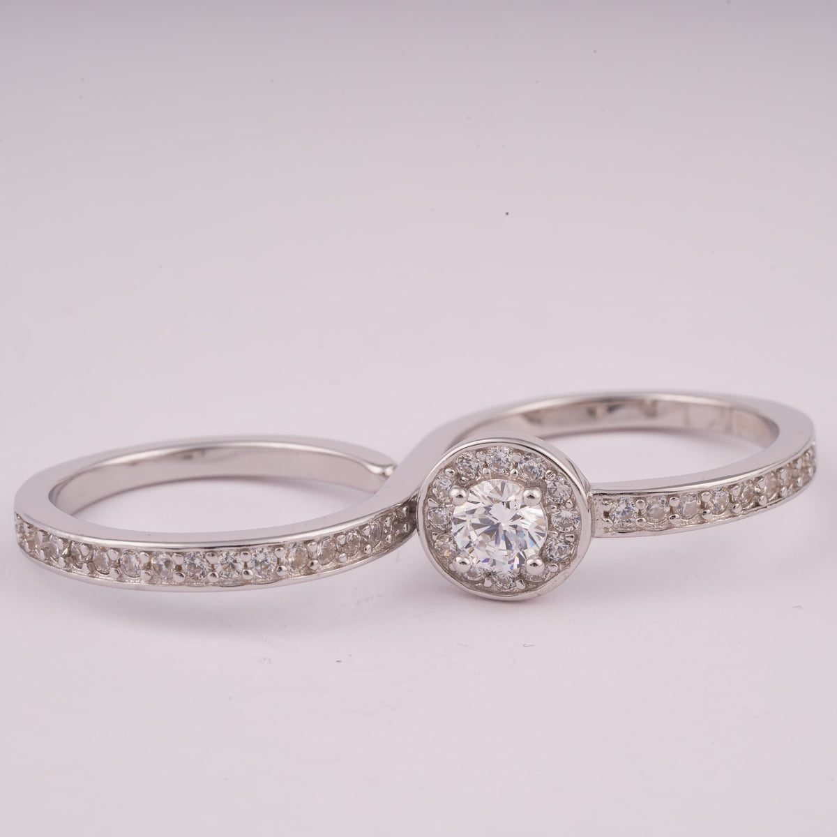 Silver Bypass Ring with Round Halo Stone