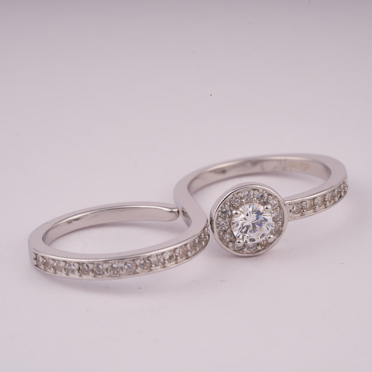 Silver Bypass Ring with Round Halo Stone